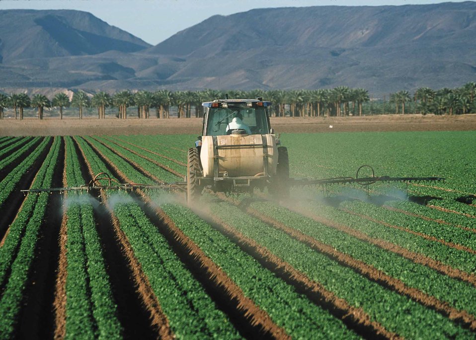 tractor spraying crops