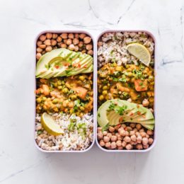 container of beans, rice and avocado