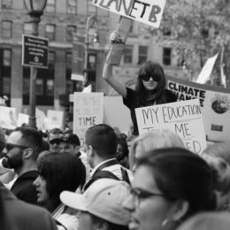 girl holding sign at protest