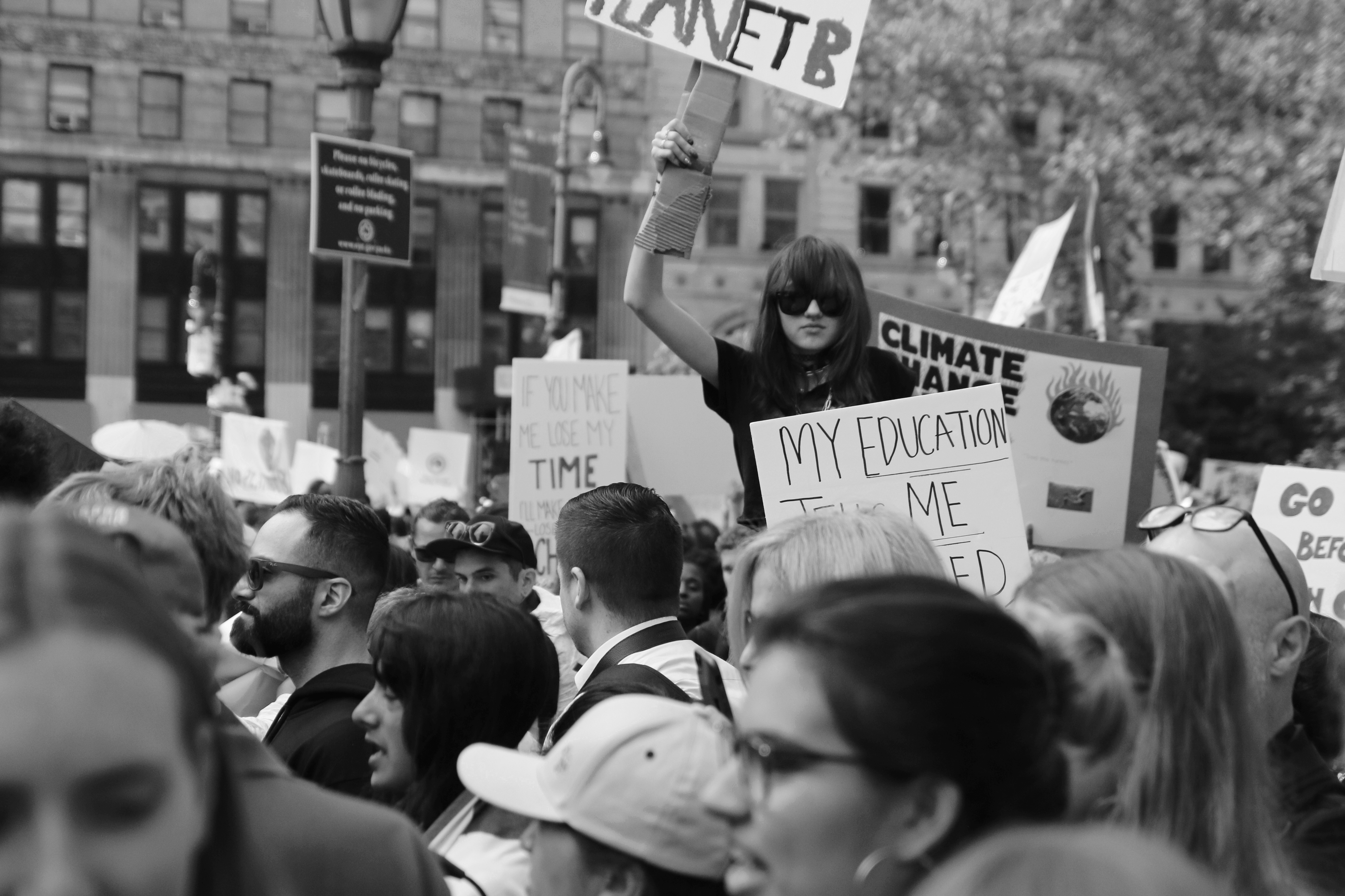 girl holding sign at protest
