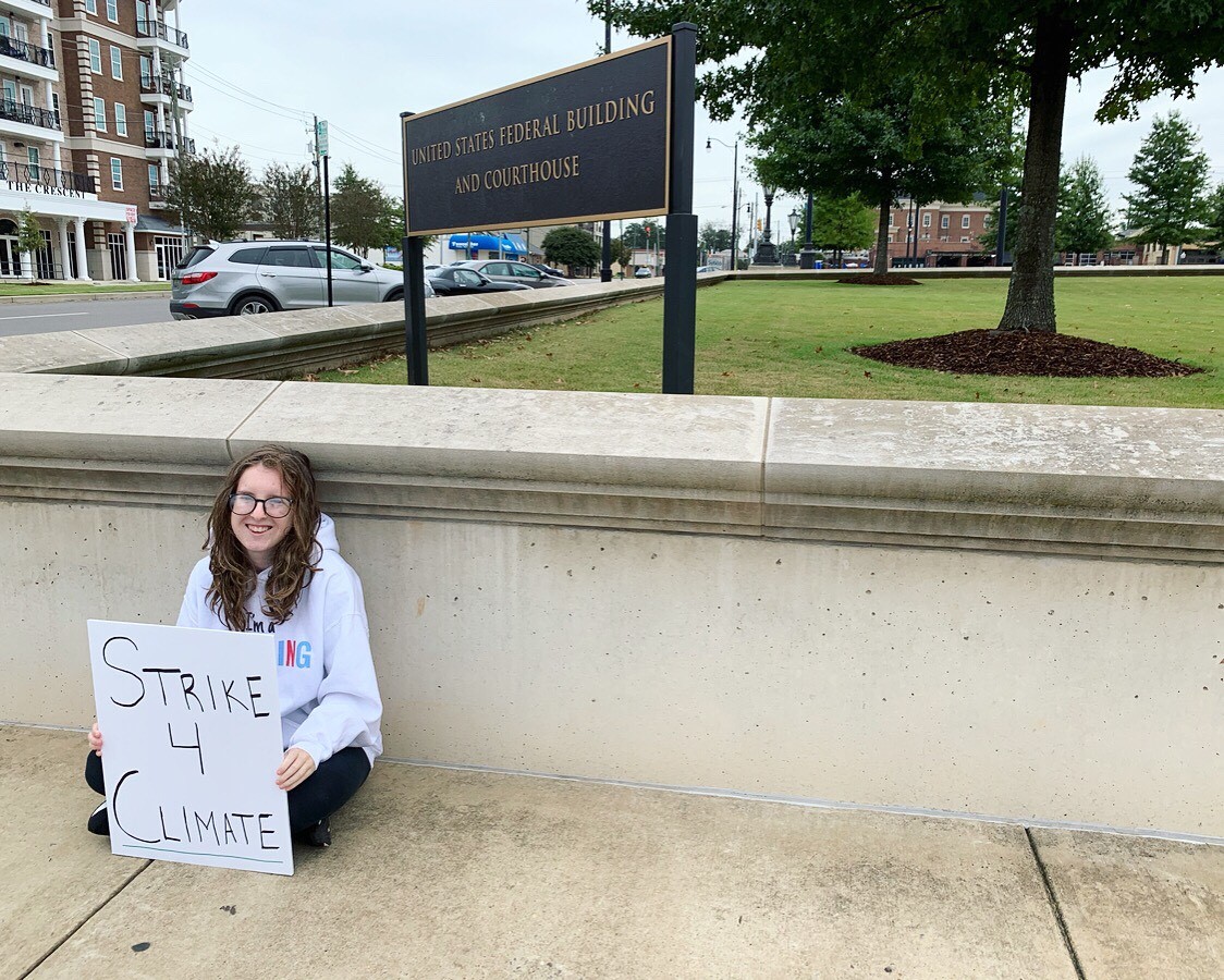 isabel holds climate strike sign