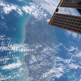 satellite hovering above ocean