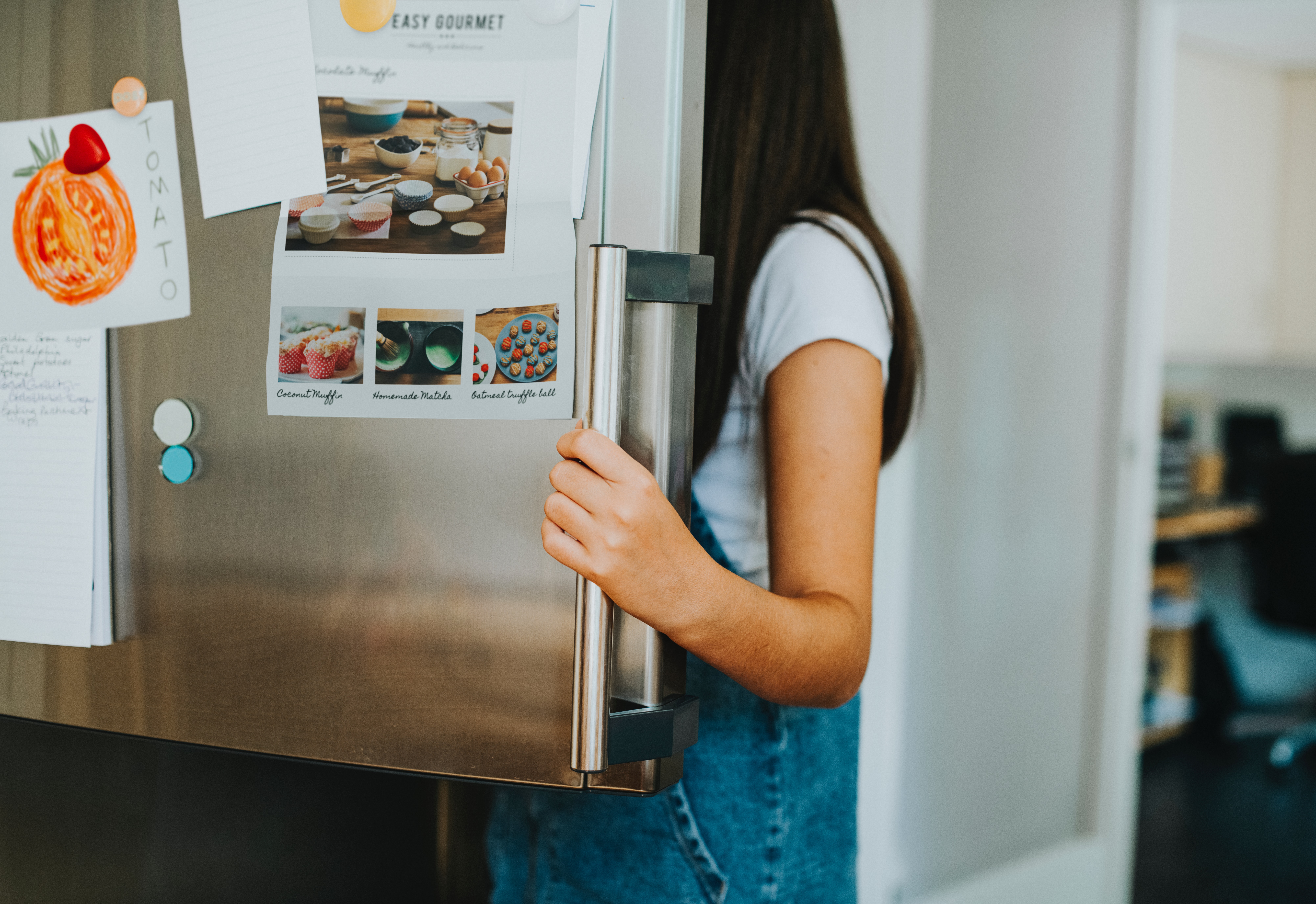 woman opening fridge