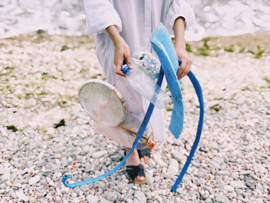 Person holds plastic trash