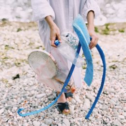 Person holds plastic trash