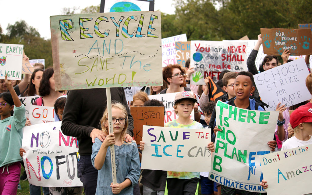 kids holding signs