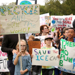 kids holding signs