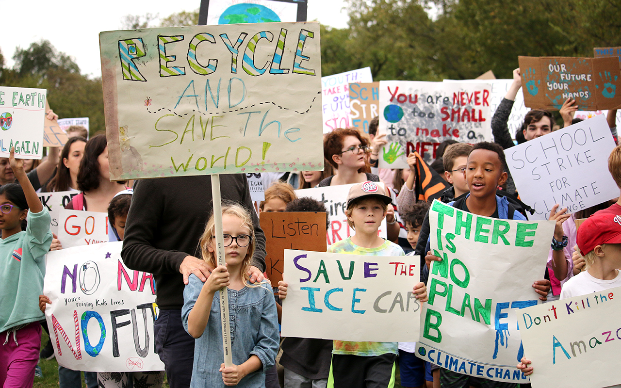 kids holding signs