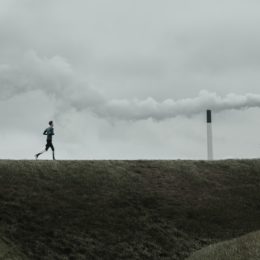 man running through air pollution