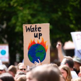 person holding wake up sign in protest