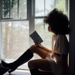 women reading in windowsill