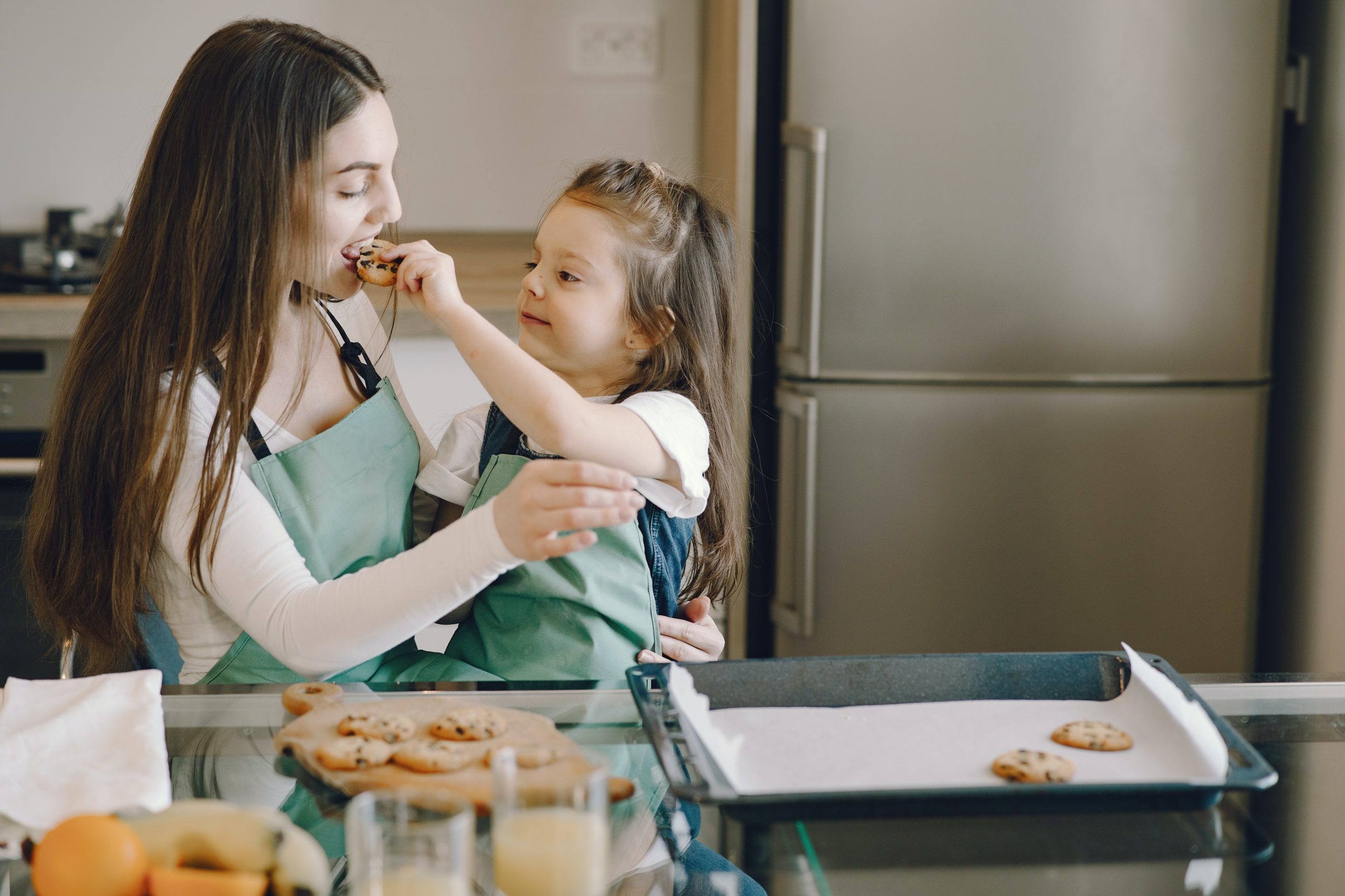 people eating cookies in kitchen