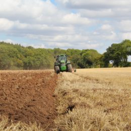 tractor plowing a field