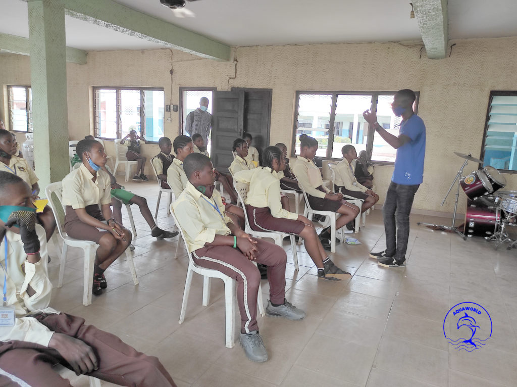 Employee from Aquaworld talking to a classroom of students in Nigeria