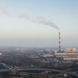 View of a horizon and sky with a factory emitting air pollution