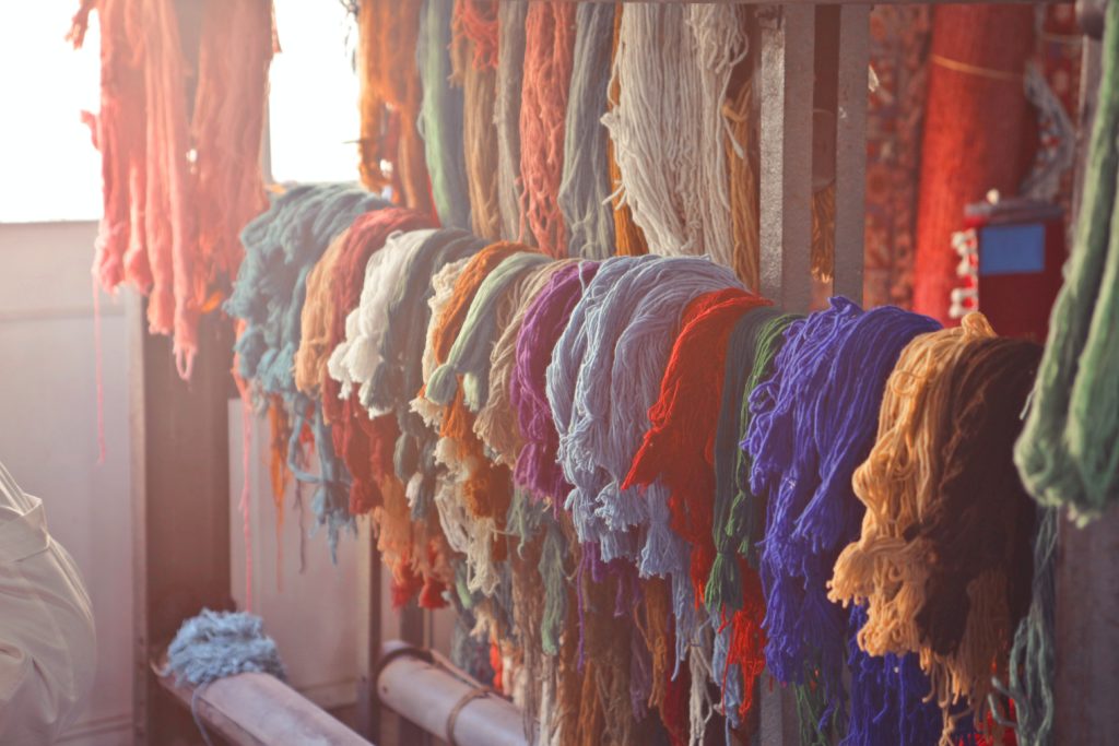 Yarn of different colors on display