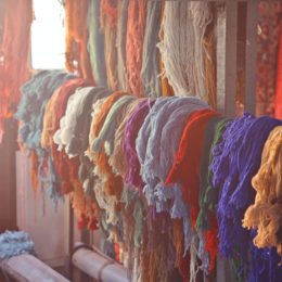 Yarn of different colors on display