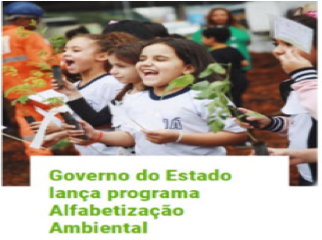 Children smiling and holding plants