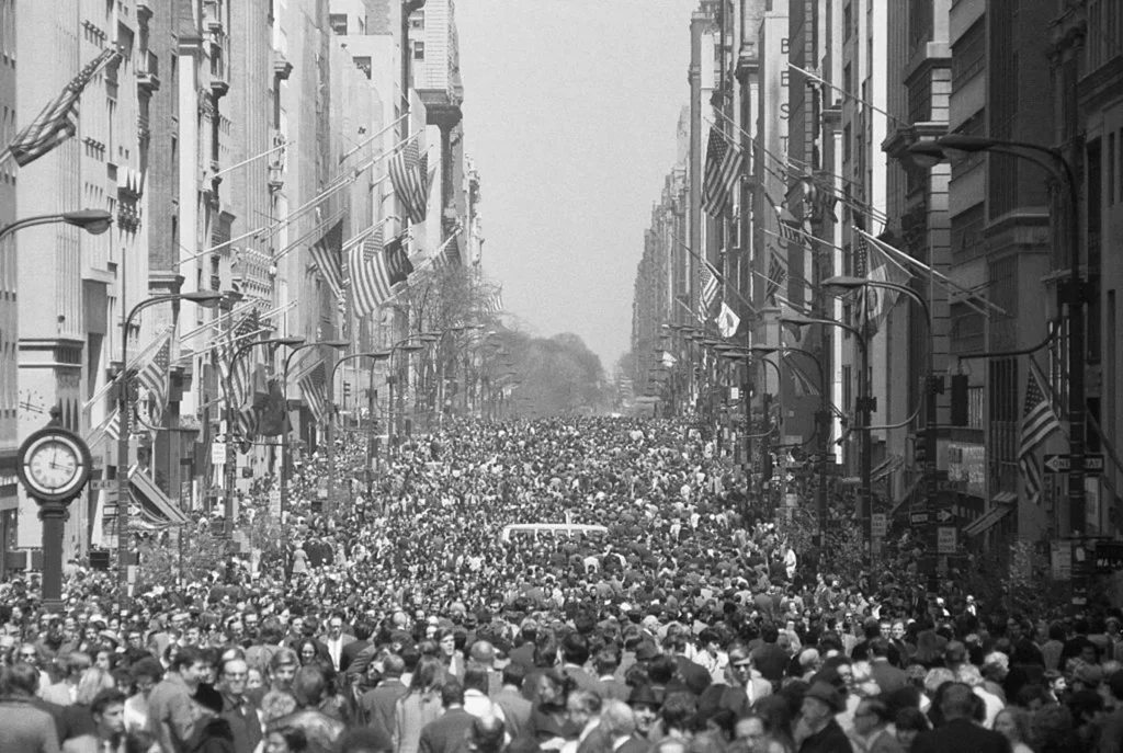 Crowd striking in a busy street. Black and white image.