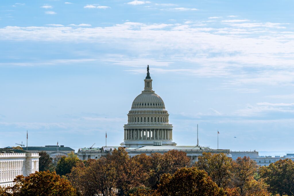 State Capitol viewed from front, cloudy and sunny sky.