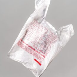 Plastic bag floating against grey background