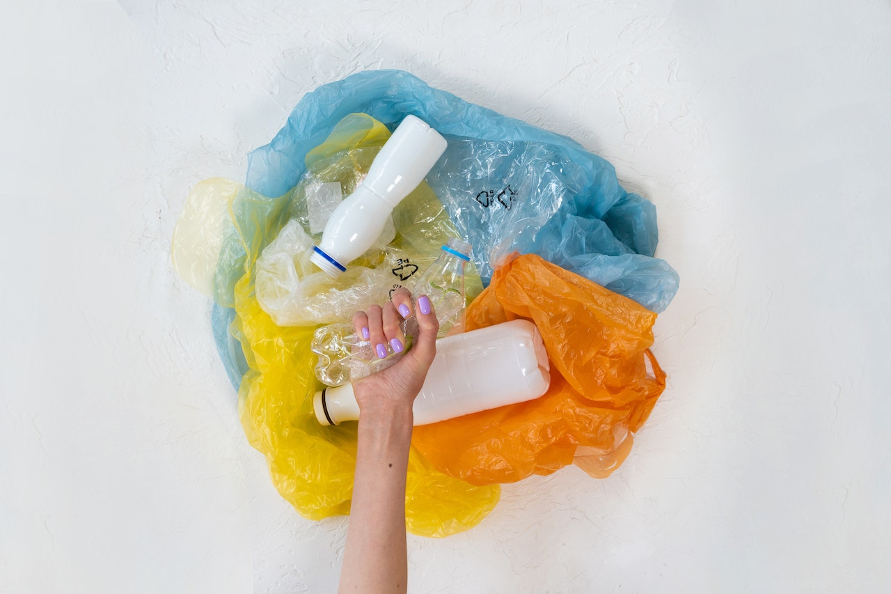 hand holding plastic bottles