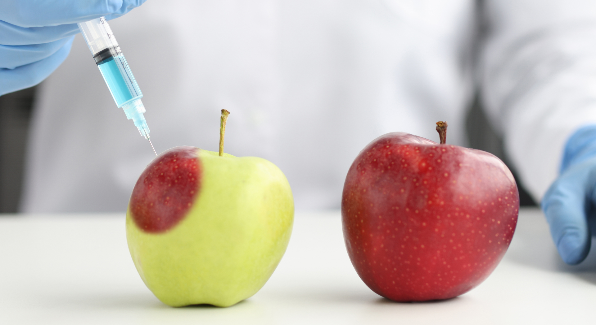 syringe in apples