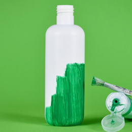 Plastic bottle with green paint