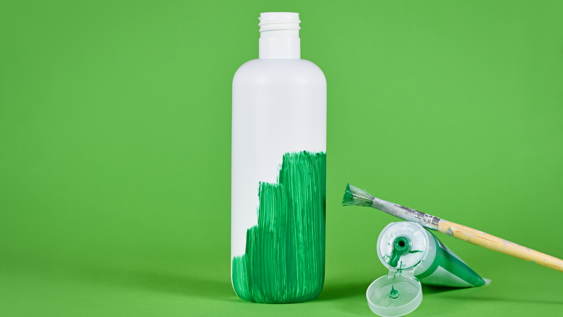 Plastic bottle with green paint