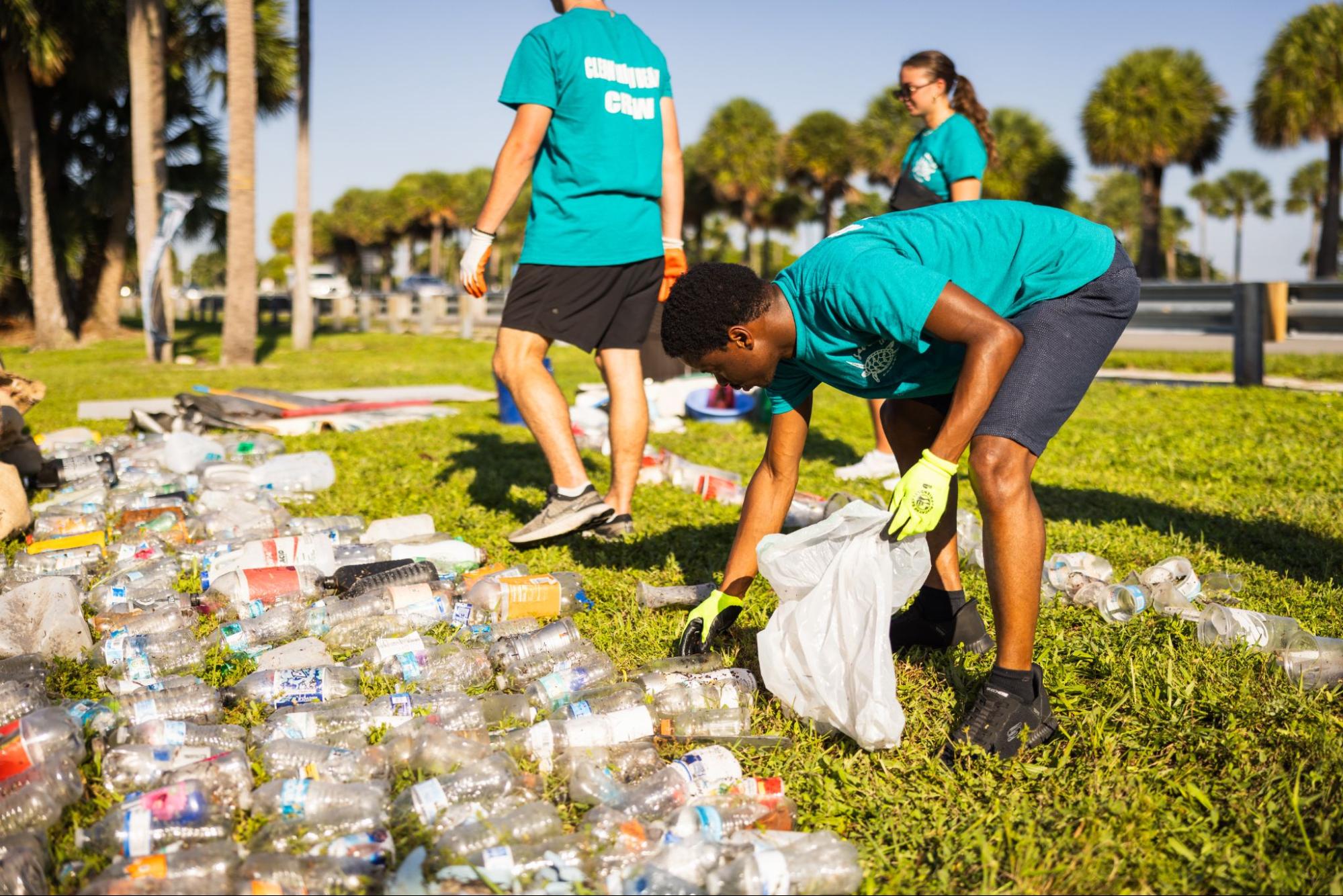 Volunteer sorting plastic water bottles