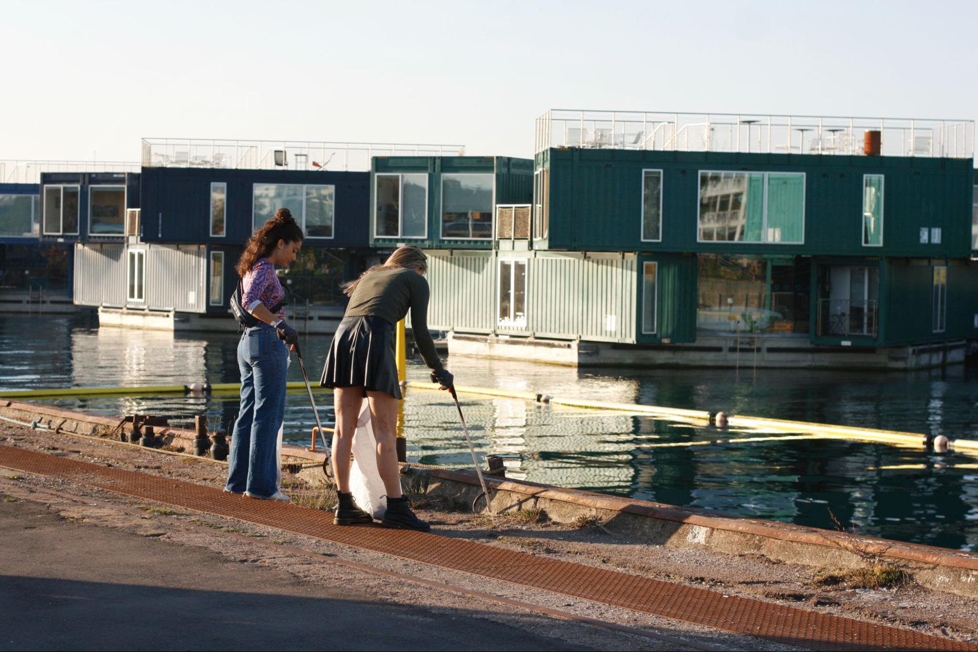 Volunteers removing cigarette butts near the waterside