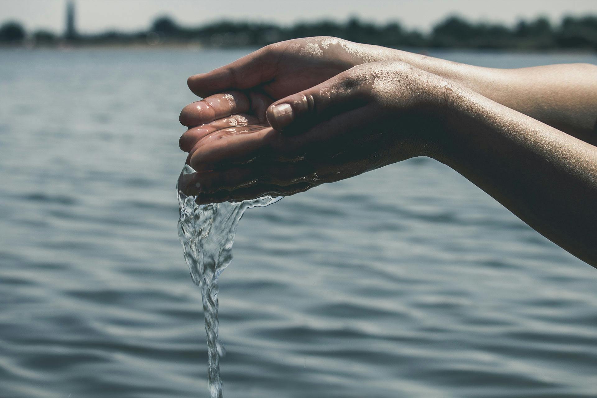 Hands pouring water