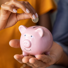 People holding piggy bank.
