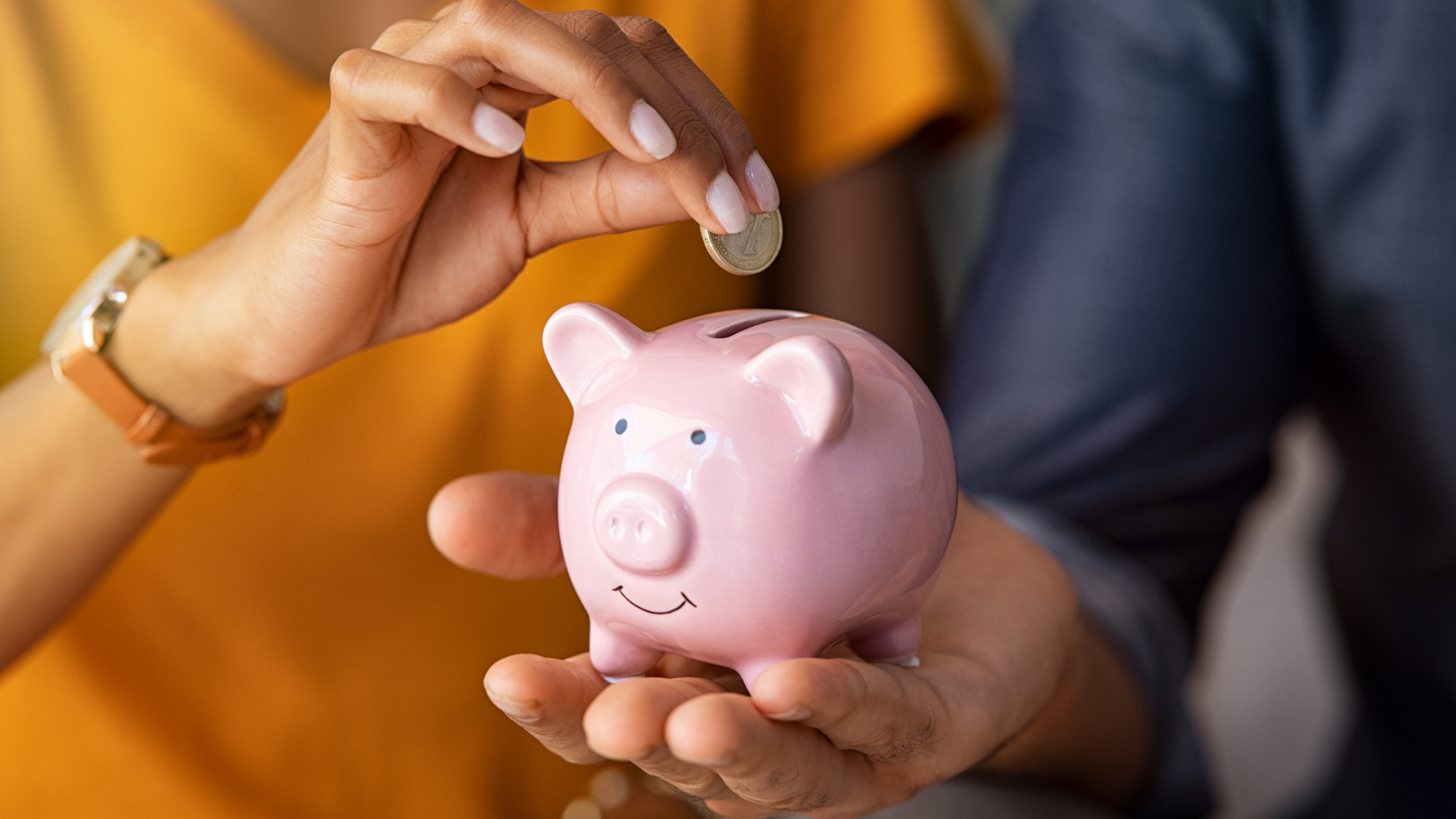 People holding piggy bank.
