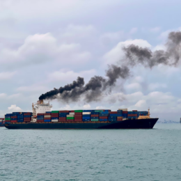 Container ship emitting air pollution