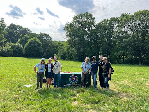 At the cleanup site with, in a grassing field with trees behind. From left to right : Alison Waliszewski (Director of Regional Policy & Program Development at 5 Gyres), Katie Abare (Wetland Scientist at Charleston Surfrider and 5 Gyres Ambassador), Me! Terran Fielder (Media Specialist at EARTHDAY.ORG), Megan Kuzniewski (Community Volunteer Ambassador at Rock Creek Park NPS), Aminah Taariq-Sidibe (Manager of End Plastics Initiative at EARTHDAY.ORG), Nick Kemble (Program Associate at 5 Gyres), Sarah Davies (Director of Communications and Media at EARTHDAY.ORG)