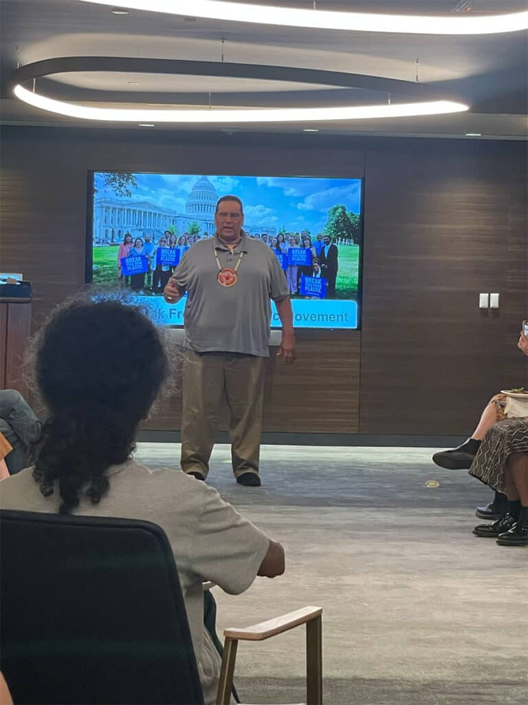 Peter Landeros giving a presentation to seated audience