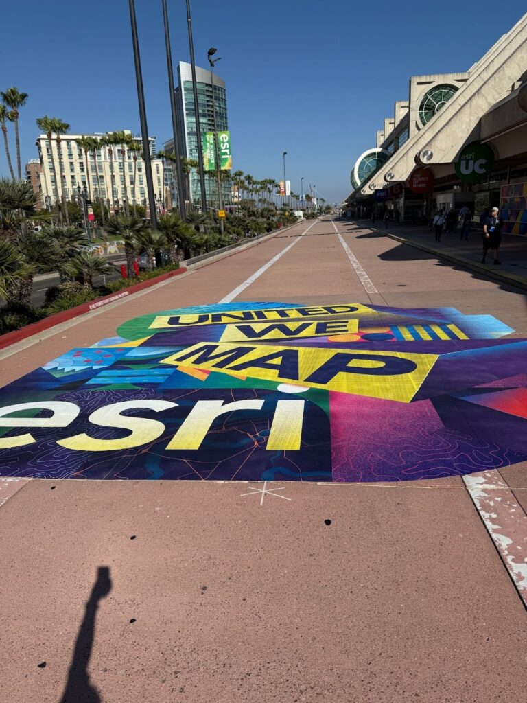The street art outside the Conference Center saying “United We Map