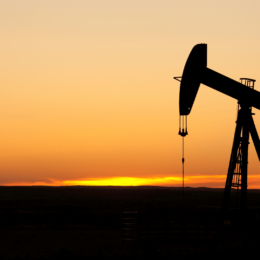 Oil well at sunset