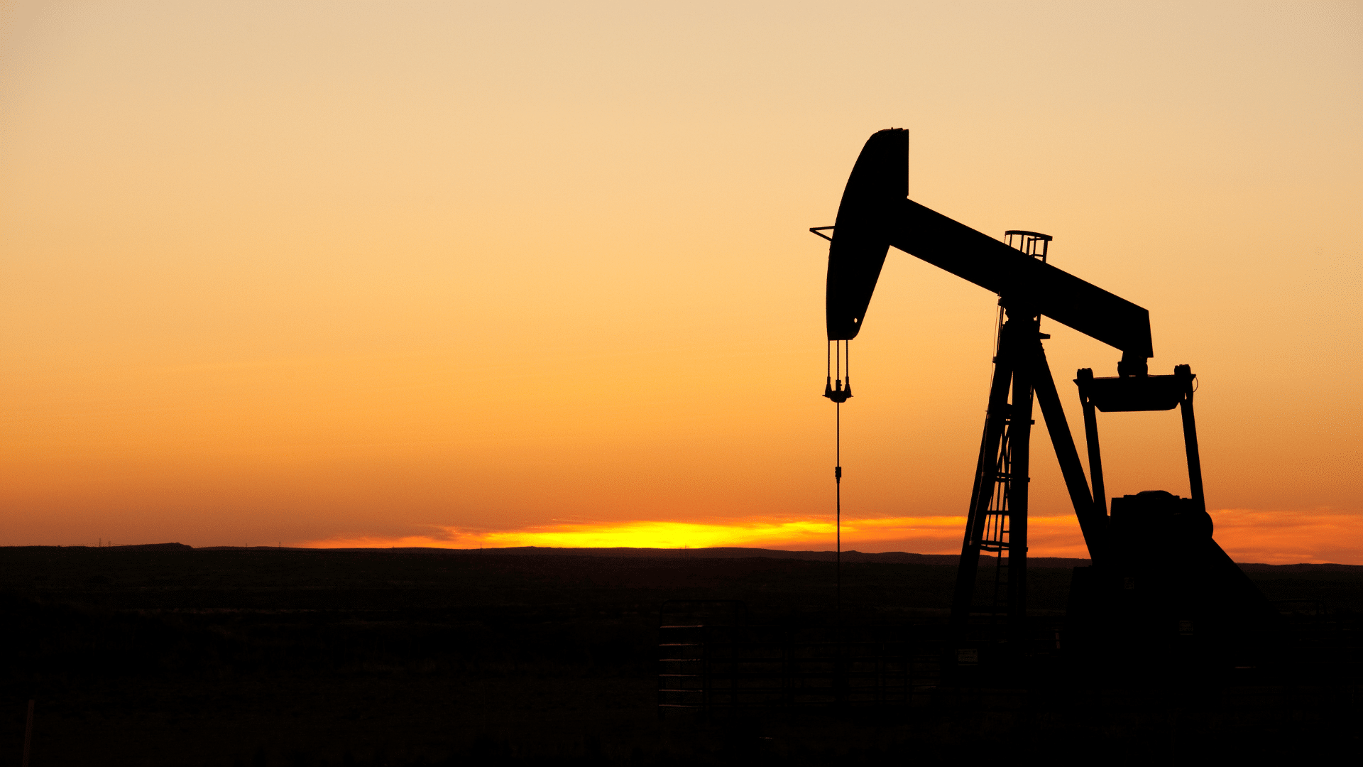 Oil well at sunset