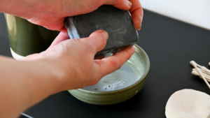 Person washing hands with natural soap
