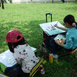 Children drawing outdoors