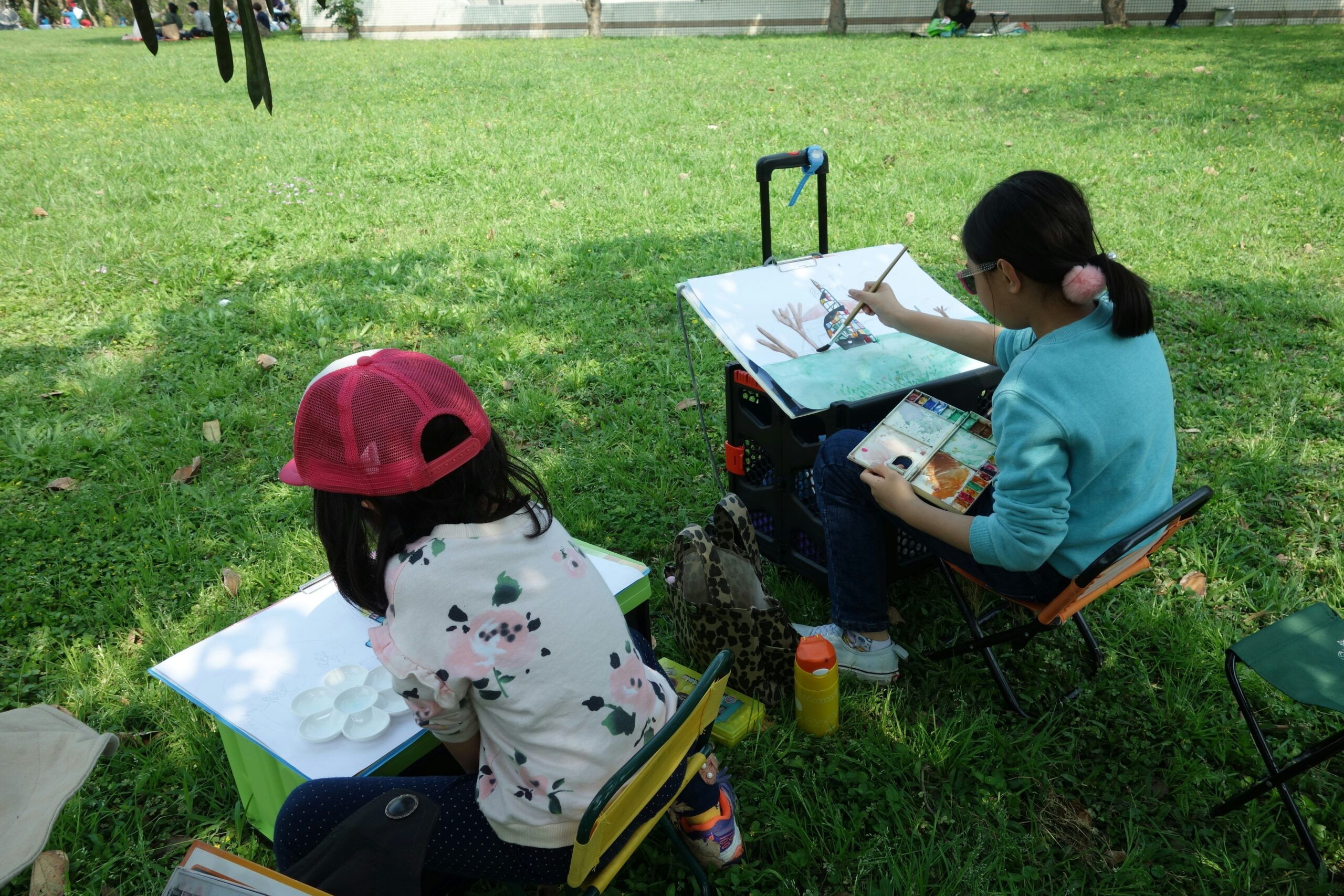 Children drawing outdoors