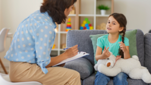Young girl talking to a therapist