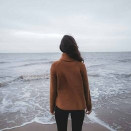 Woman staring at the ocean