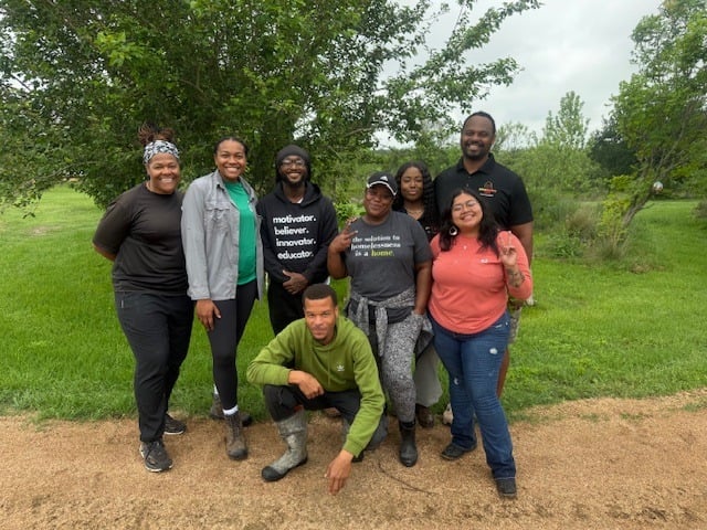 A group photo of African American Youth Harvest Foundation volunteers at Casa de Miel.