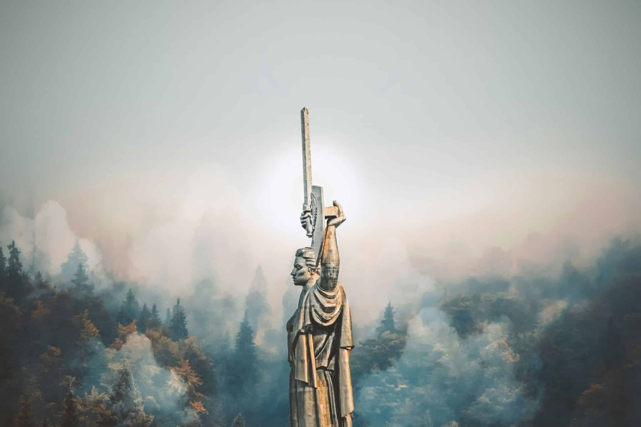 person standing on cliff painting -- Photo by Rostislav Artov on Unsplash