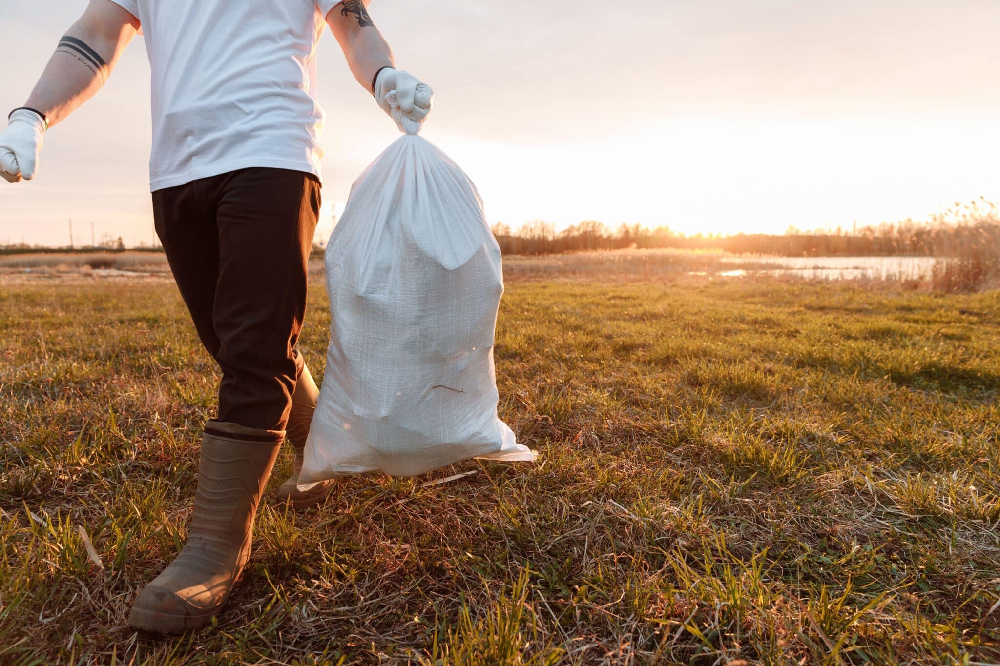 Man carrying trash bag