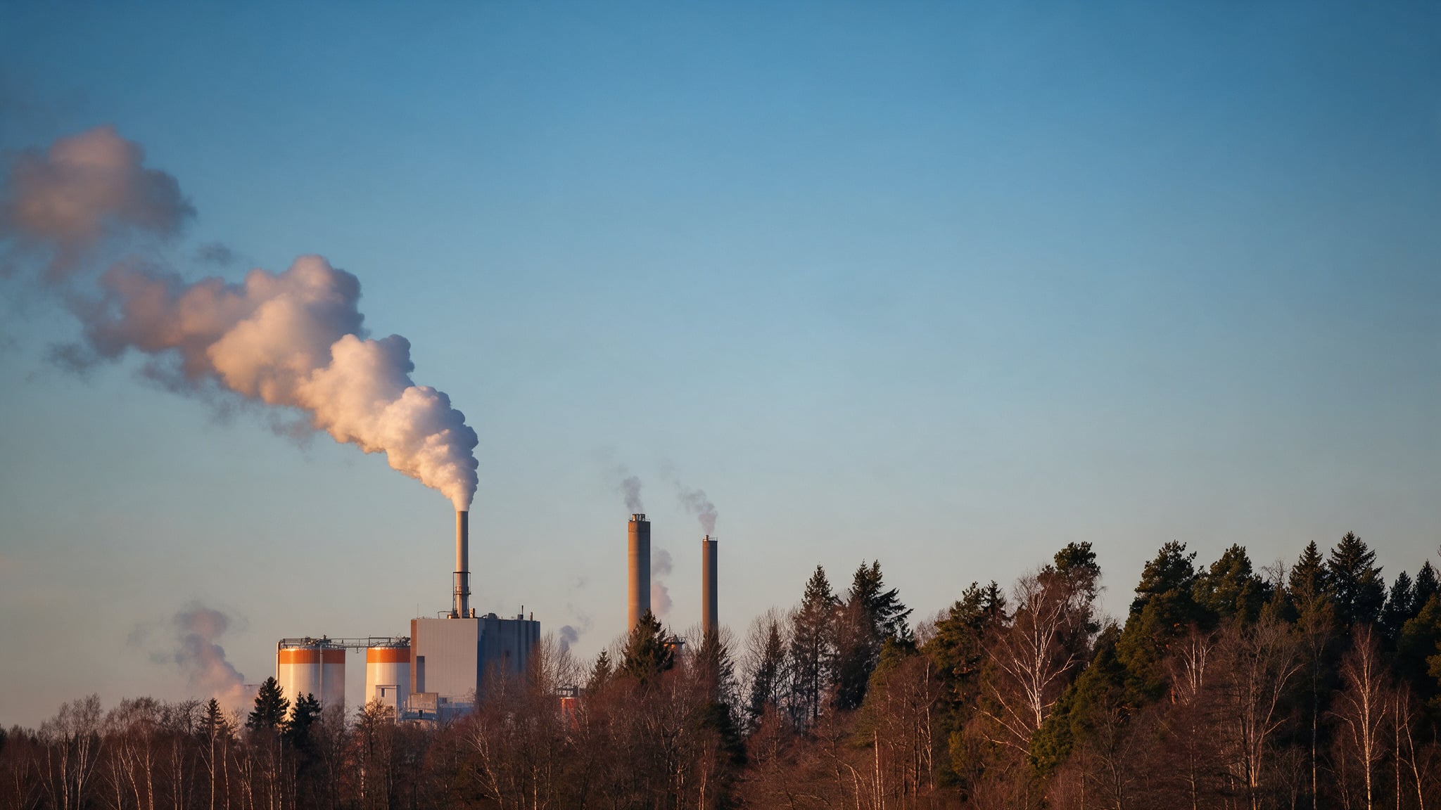 Smoke rising from factory smokestacks