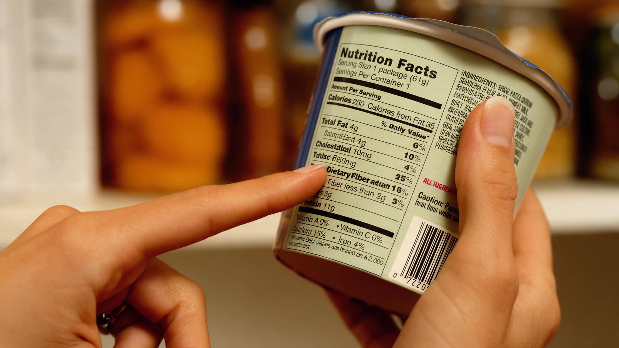Person reading a nutrition facts label